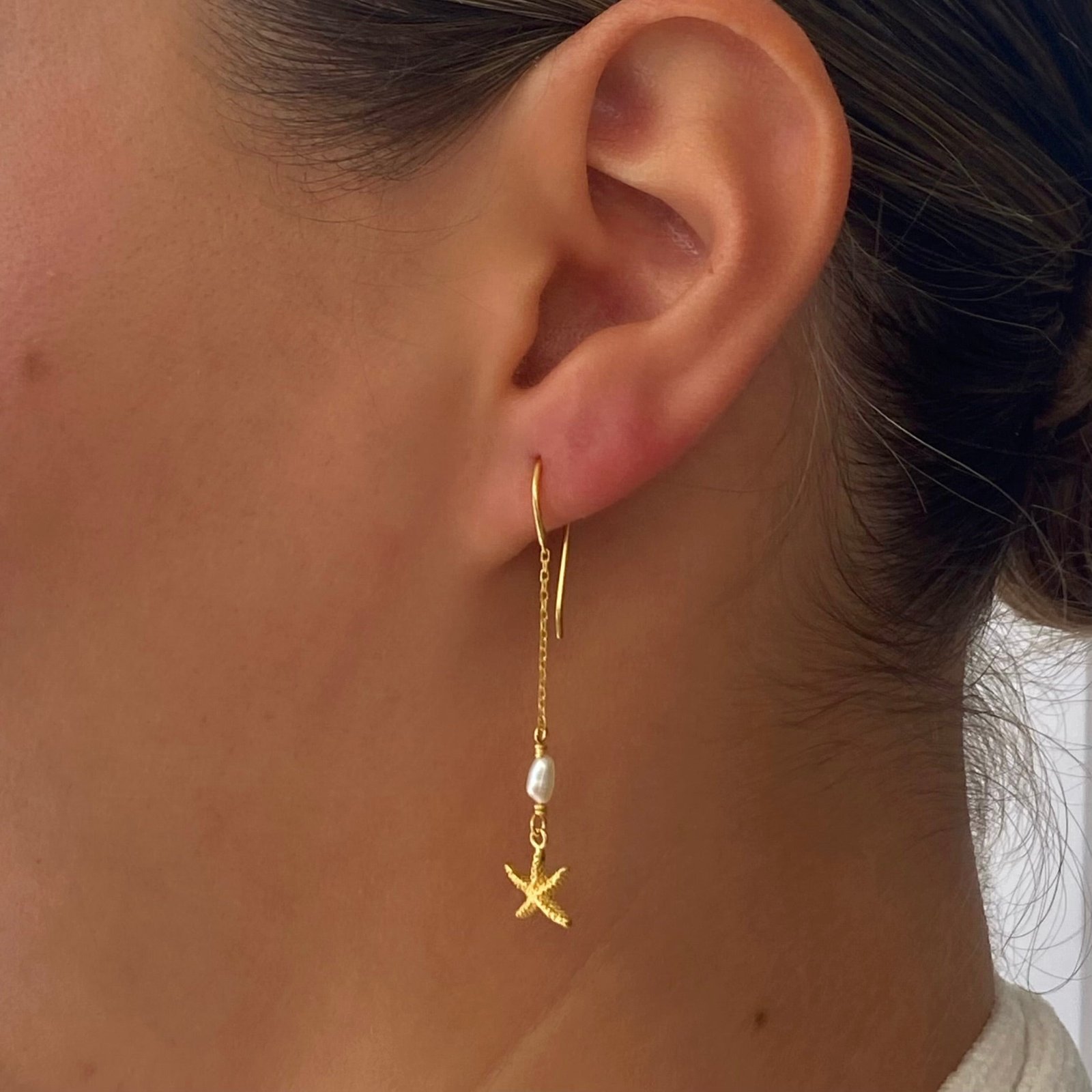 Sunlit Shores Starfish Pearl Earrings in gold vermeil featuring freshwater pearls and delicate starfish details inspired by the ocean.